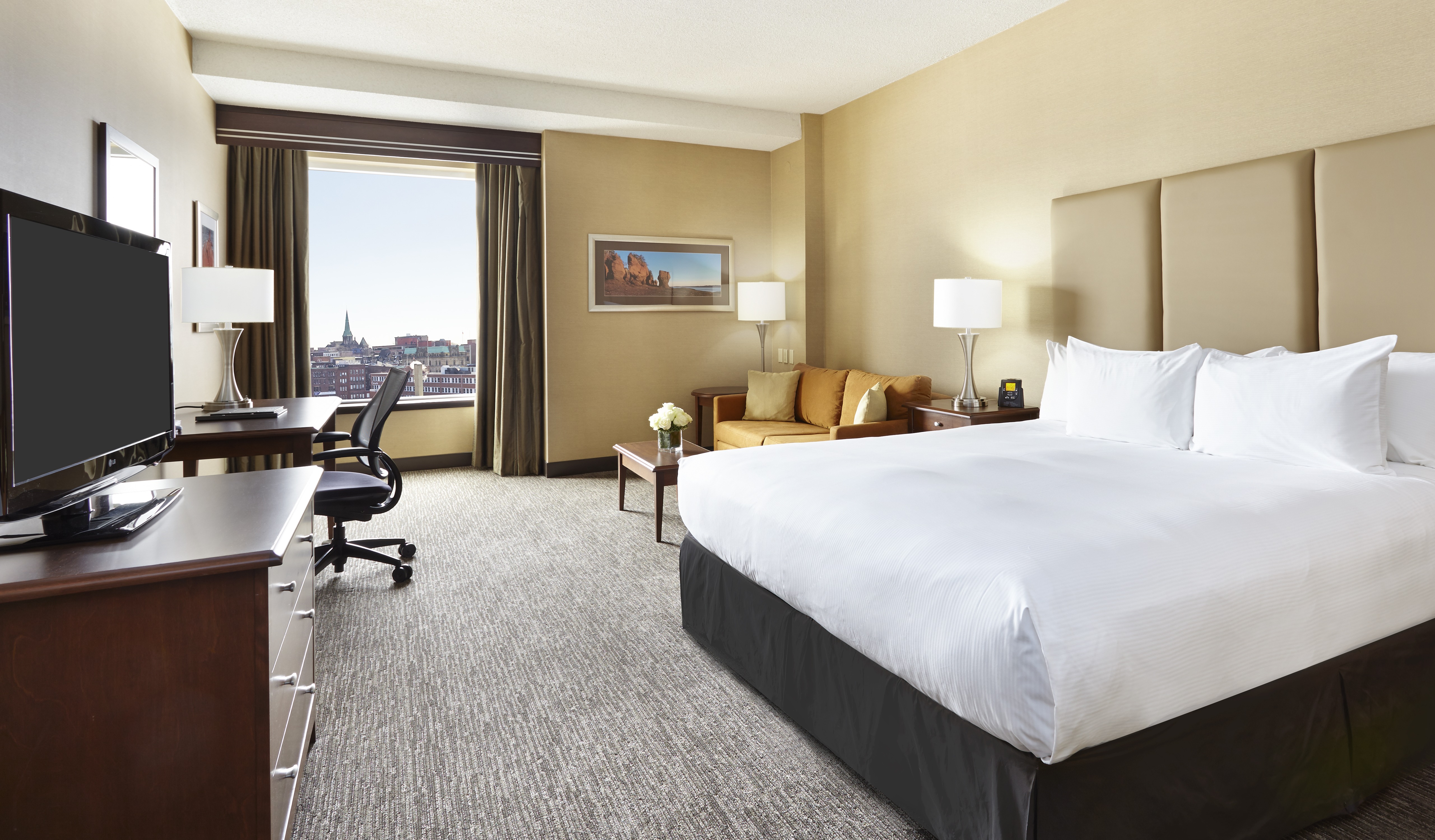 One king bed with city views of Saint John. 