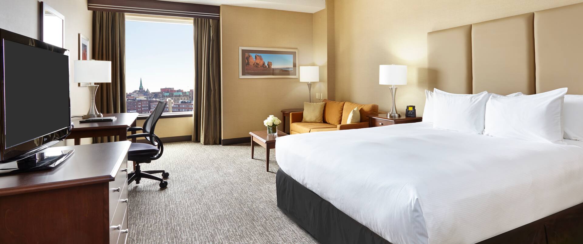 One king bed with city views of Saint John. 