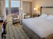 Accessible Guestroom with King Bed, Work Desk, Chairs and Outside View of Stadium