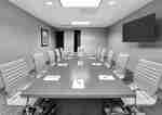 Boardroom with Meeting Table, Office Chairs and Wall Mounted TV