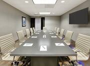 Boardroom with Meeting Table, Office Chairs and Wall Mounted TV