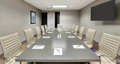 Boardroom with Meeting Table, Office Chairs and Wall Mounted TV