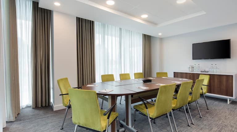 Meeting Room with Table, Chairs and Wall Mounted HDTV