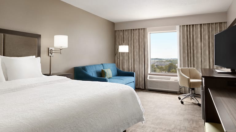 One King Bed Guestroom with Sofa, Outside View, Work Desk and HDTV