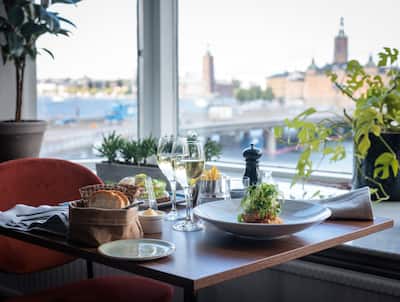 Table Set for Dinner at a Restaurant with City View