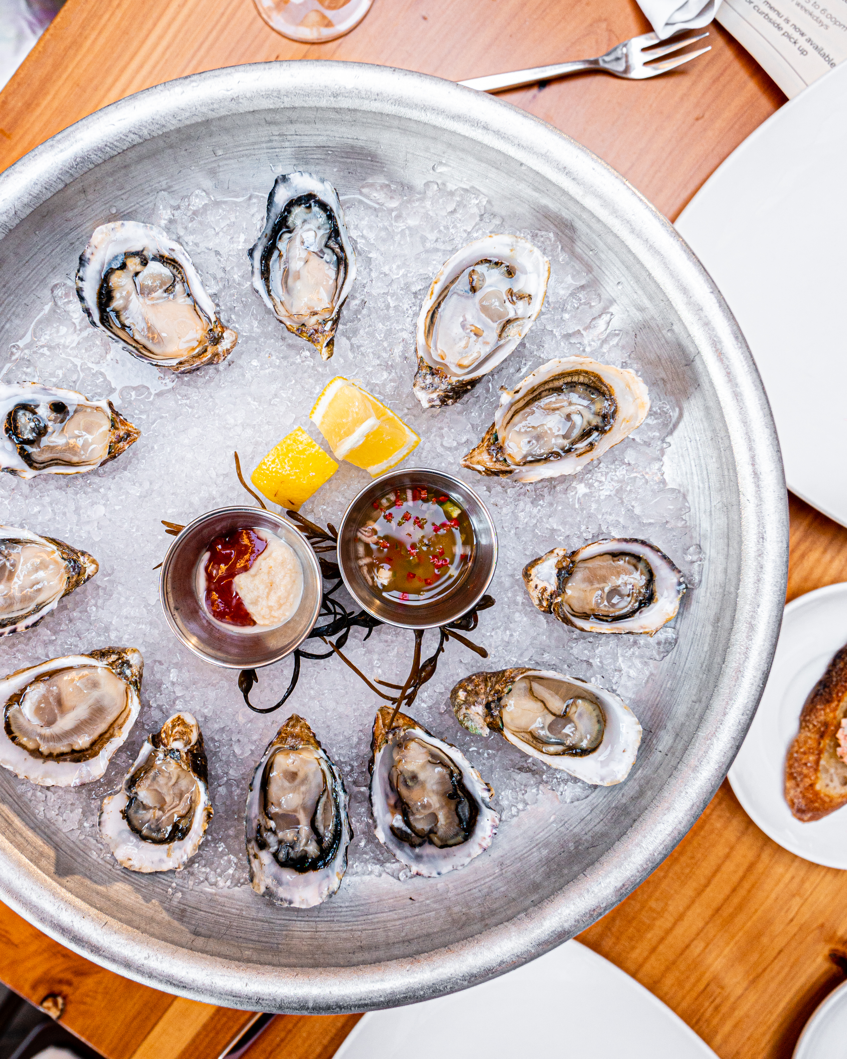 Oysters on a plate with dipping sauces