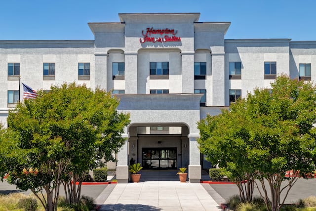 exterior front of hotel in the day