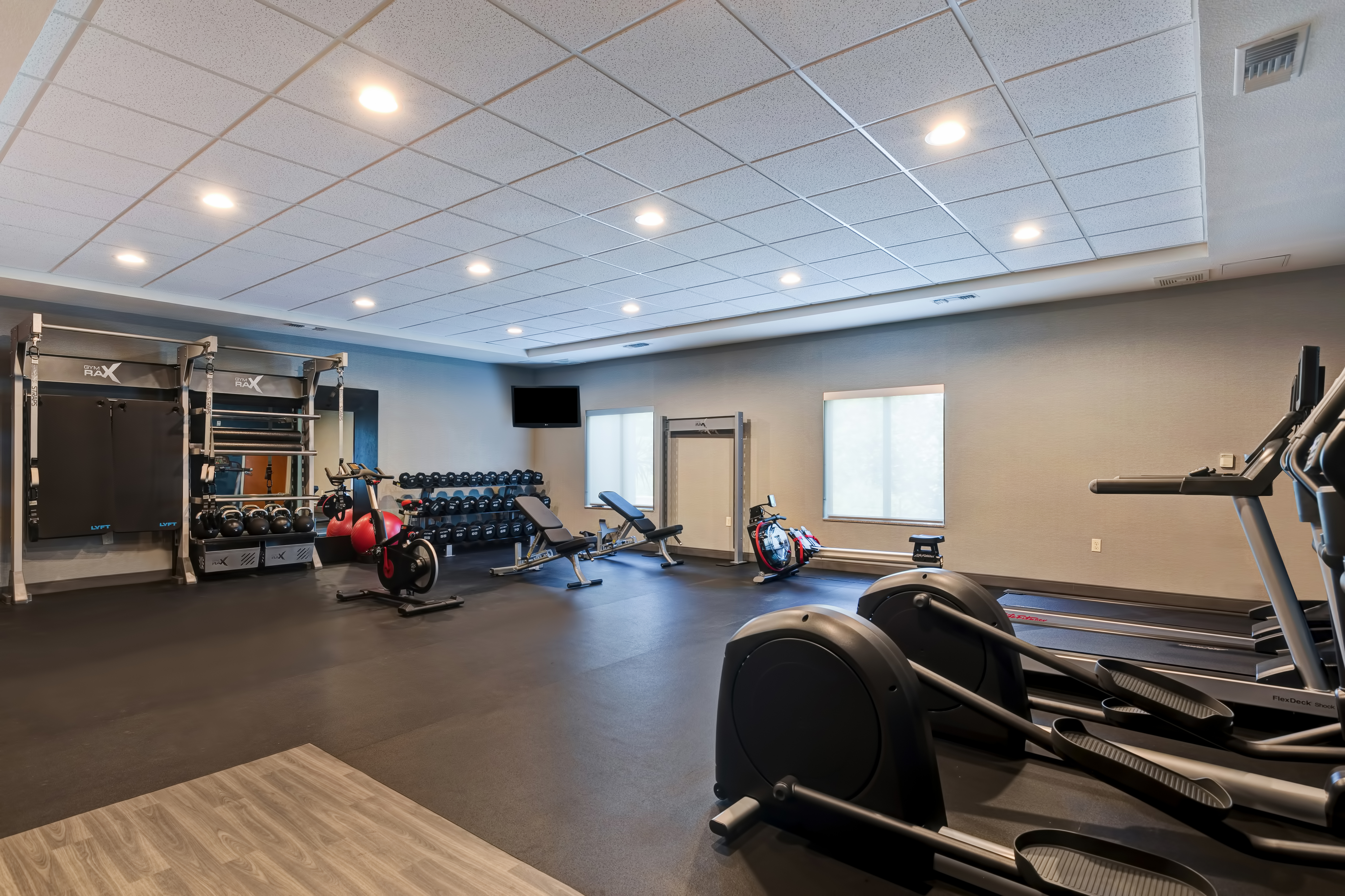 fitness center with various machines and weights