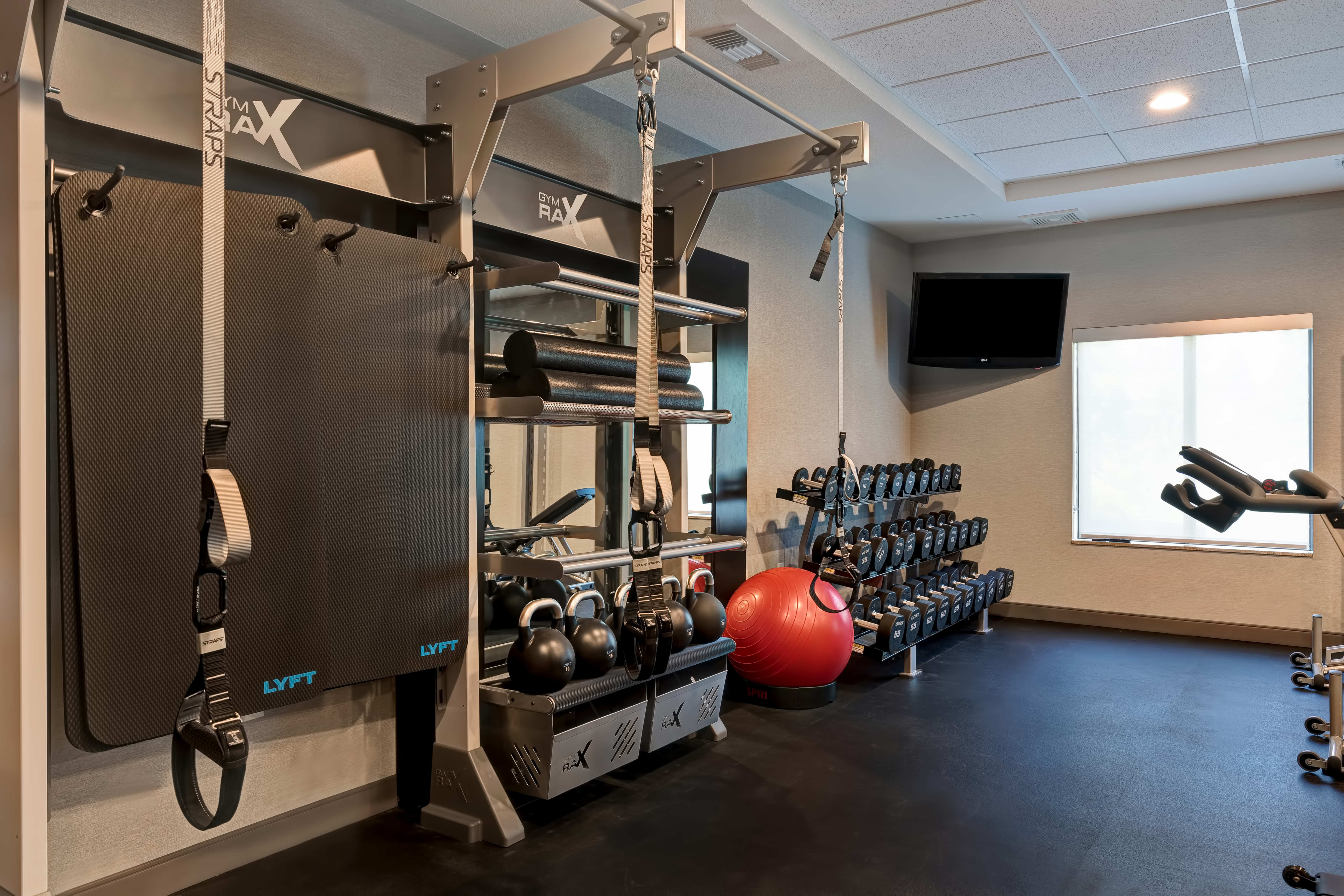 fitness center with various machines and weights