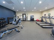 Fitness center with cardio machines and weightbench