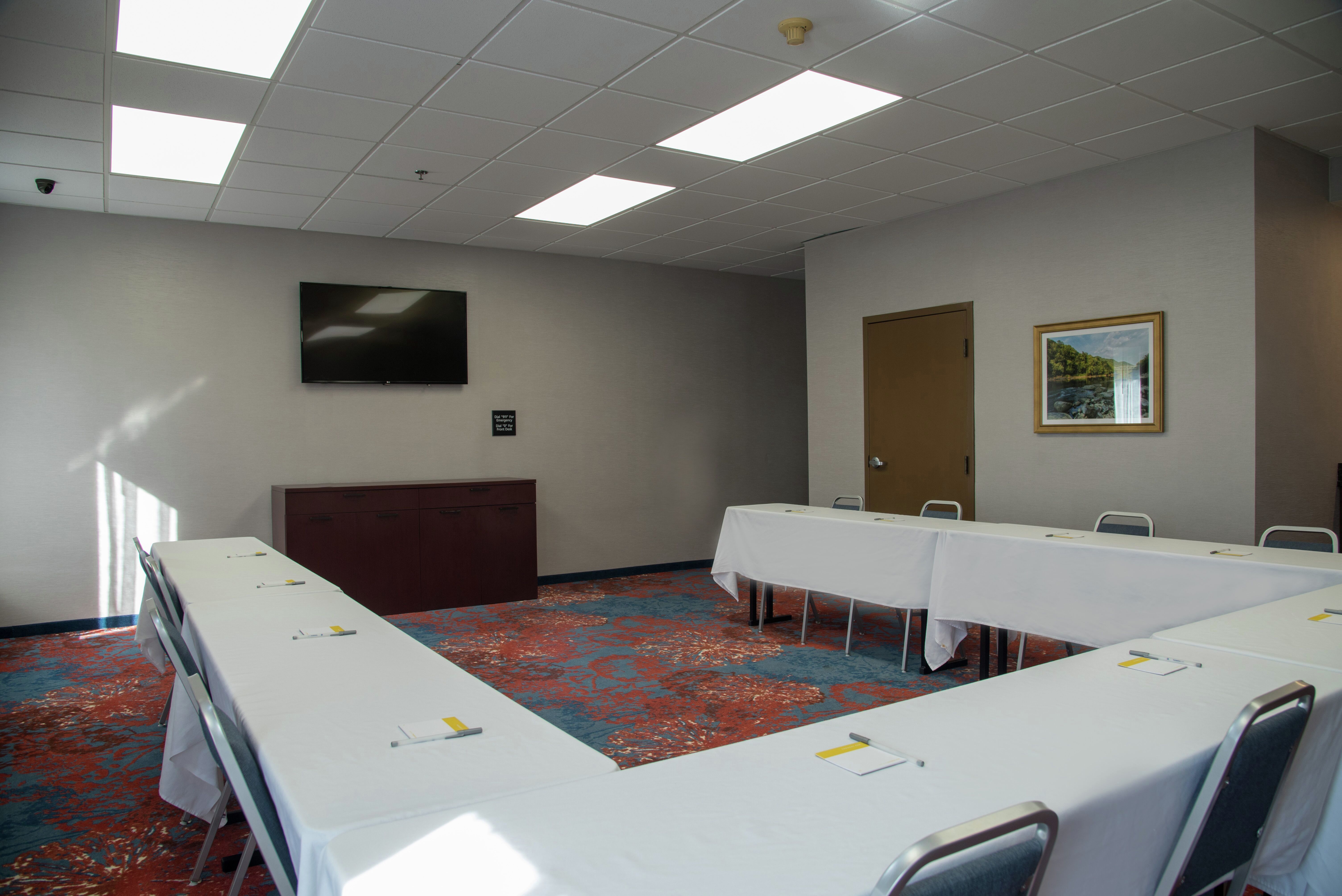 Meeting Room with U-Shaped Table and Room Technology