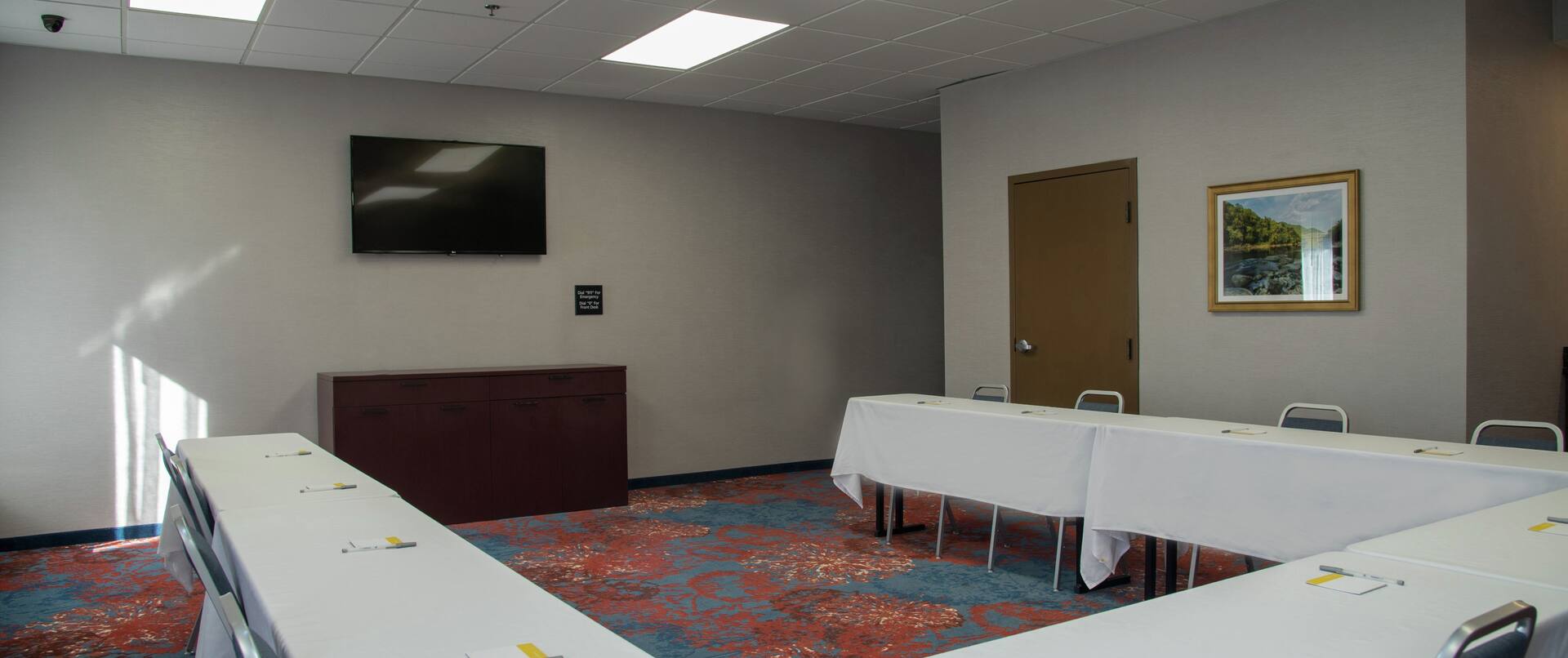 Meeting Room with U-Shaped Table and Room Technology