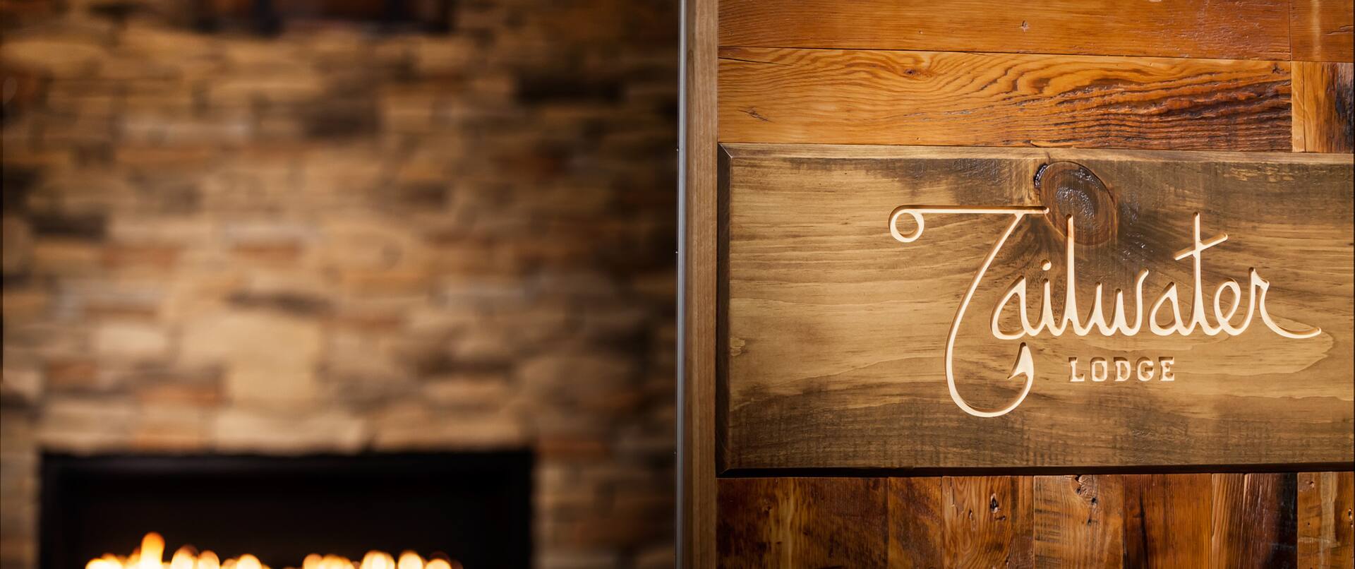 Tailwater Lodge Sign And Lobby Fireplace