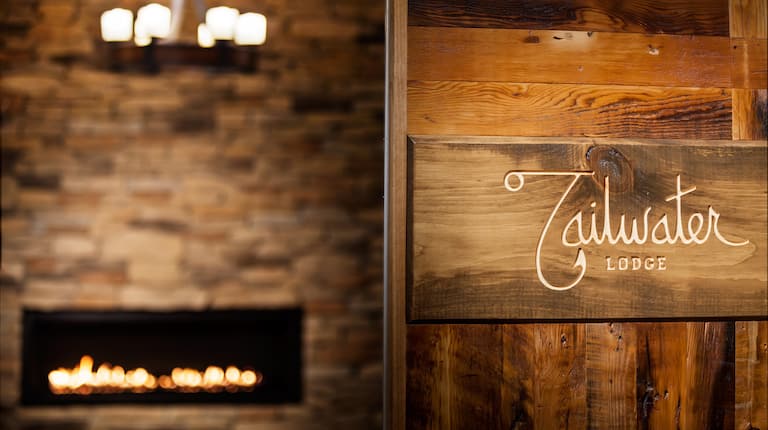 Tailwater Lodge Sign And Lobby Fireplace