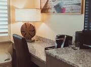 Desk Area and Coffeemaker in Hotel Guest Room