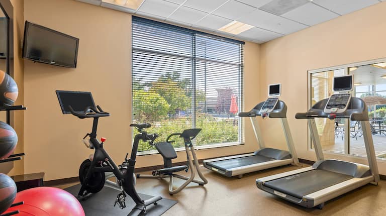 on site fitness center, peloton bike, treadmills, yoga ball