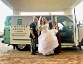 Bride getting out of Embassy Suites minibus