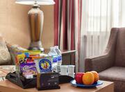 Complimentary premium suite offerings featuring coffee, bottled water, soda, and other delicious snacks for guests to enjoy. 