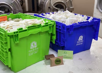 Recycling bins overflowing with bars of soap to be recycled and reused through Hilton's Clean the World program.