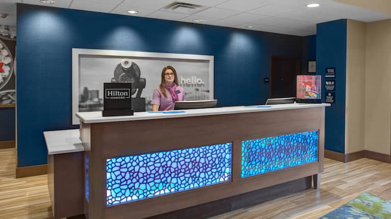 Lobby front desk with staff agent ready to help