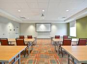 Small Meeting Space Classroom Set Up with Projector Screen