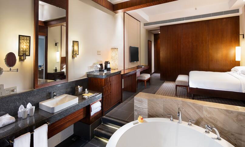 Hilton Sanya Yalong Bay Resort and Spa Hotel, China - Grand Suite Bathtub and Sink with Bed in Back-previous-transition