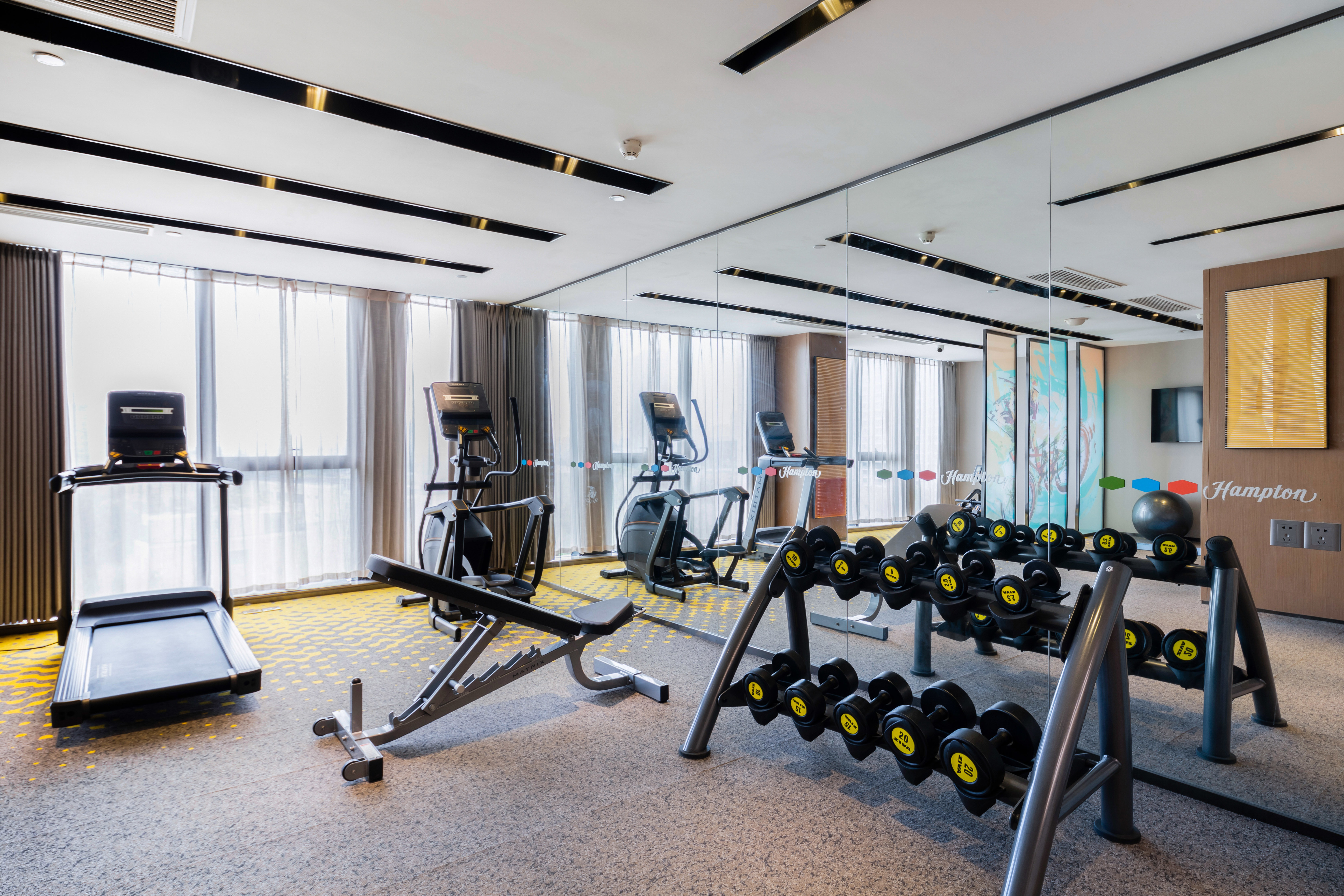 Fitness center with free weights and cardio machines