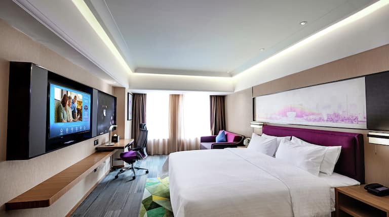 Superior Deluxe Guestroom with Bed, Room Technology, Lounge Area, and Work Desk