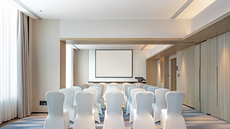 Meeting room with white chairs