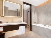 Guest Bathroom Vanity Area With Tub