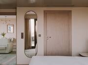 Room with mirror and bed
