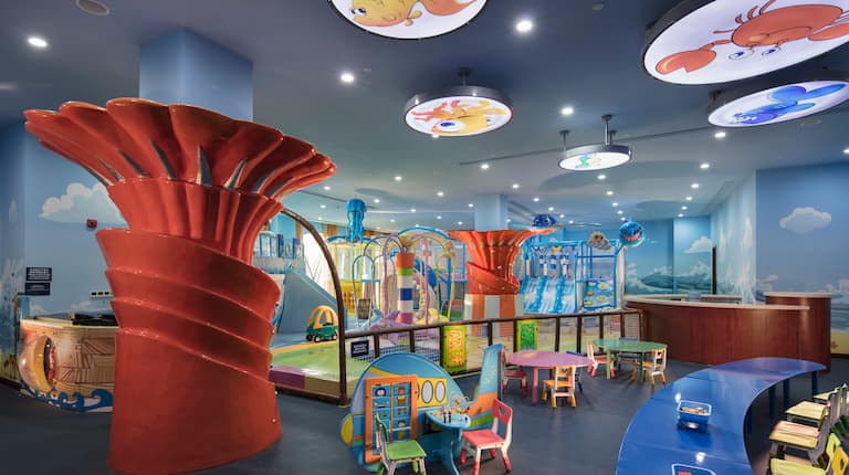 Kids Club with toys, activity tables, and small chairs