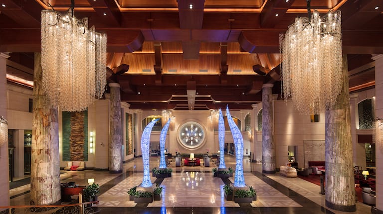 Lobby with large orient sculptures and chandeliers