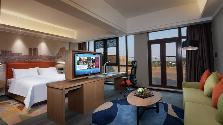 King Suite with Bed, Lounge Area, Outside View, Work Desk, and Room Technology