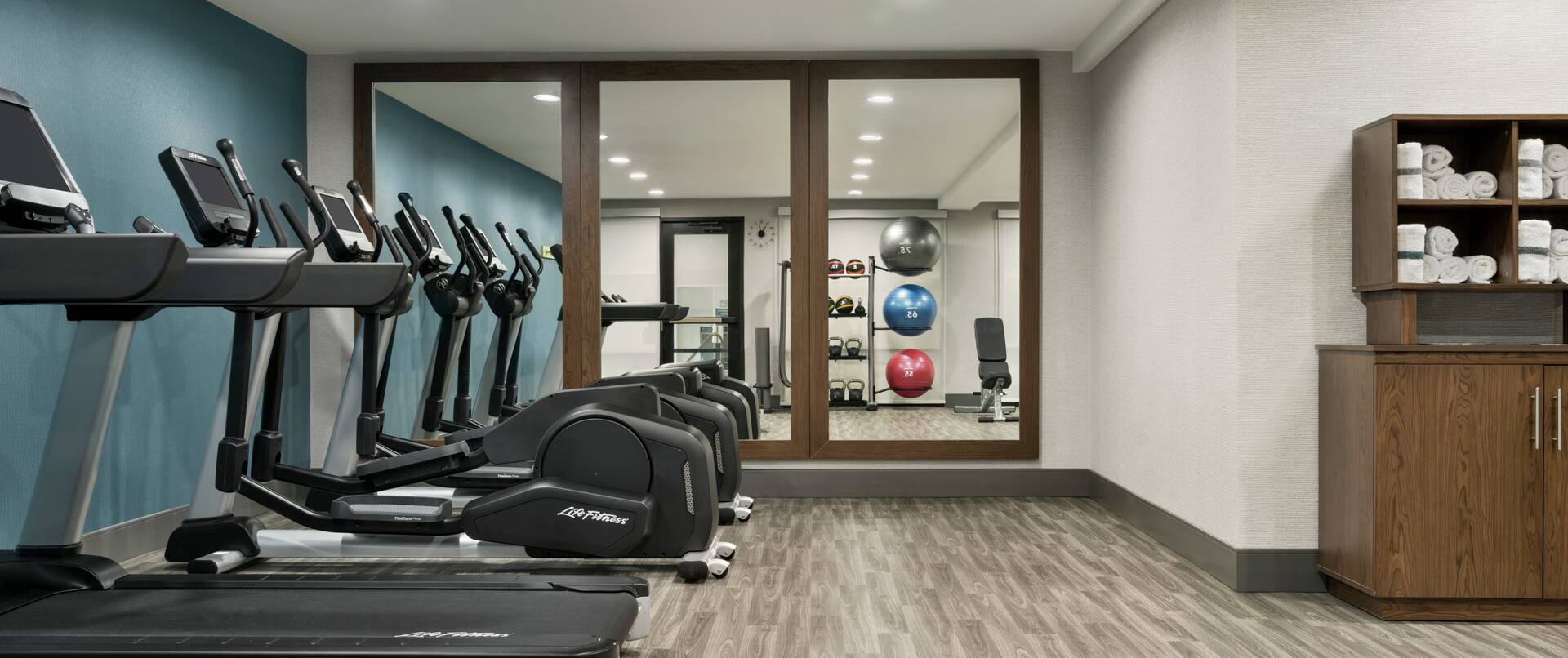 Convenient on-site fitness center featuring cardio machines.