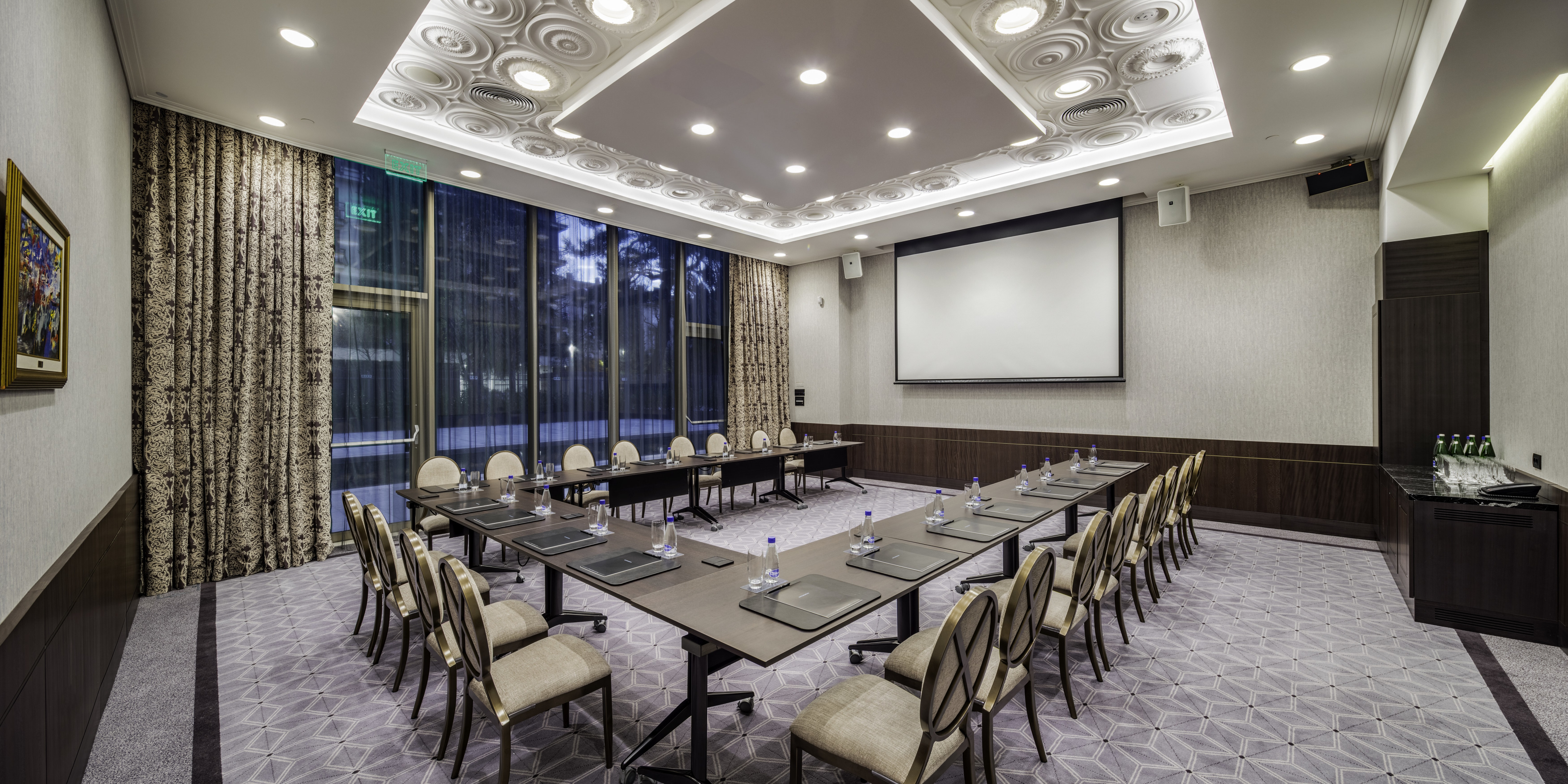 Meeting Room with U-Shaped Table and Projector Screen