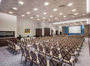 Princess Jelena Meeting Room Arranged Theater Style With Rows of Chairs Facing Projector Screen and Large WIndow