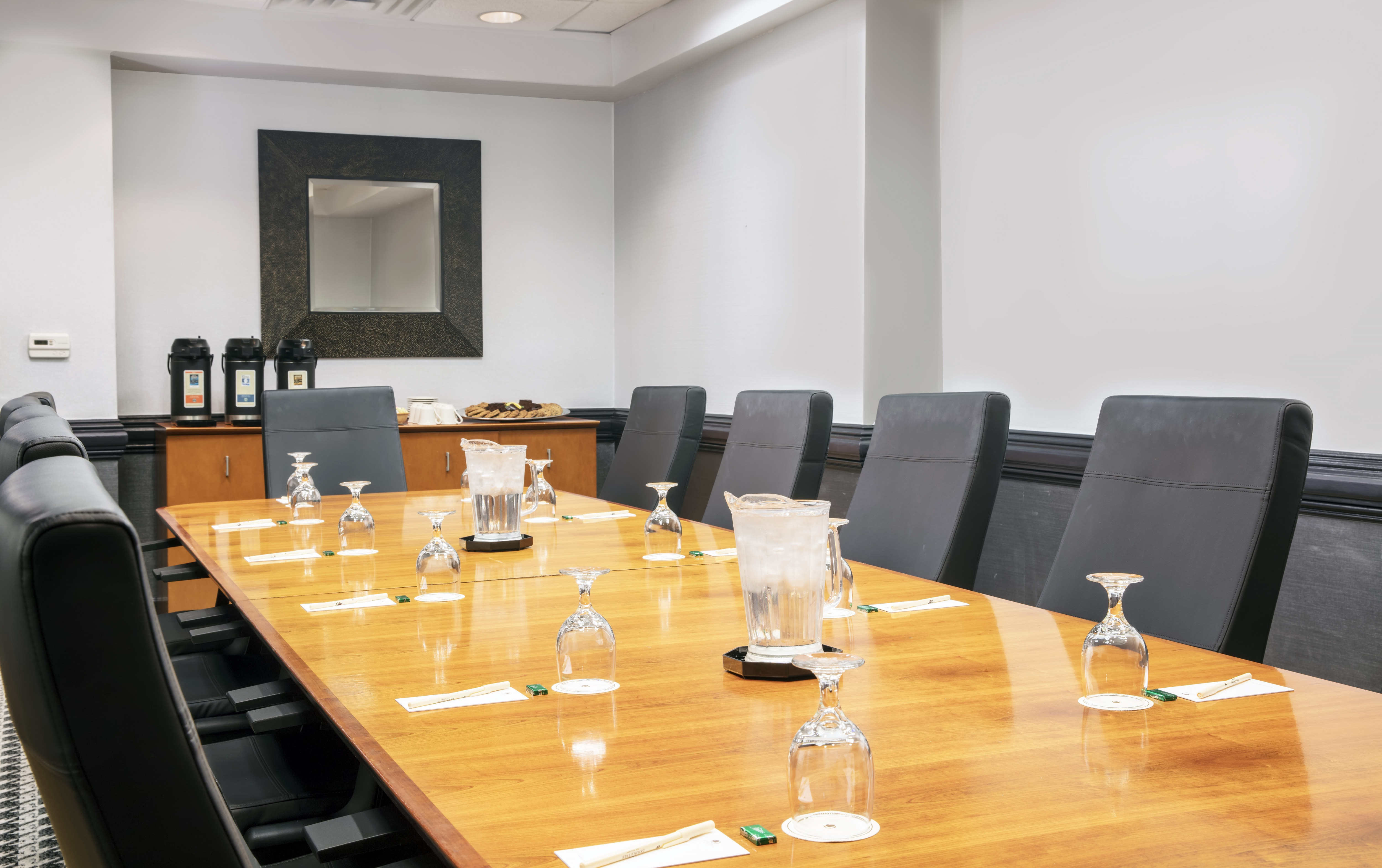Boardroom with Large Meeting Table, Office Chairs and Coffee Station