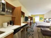 Two Queen Beds, Work Desk, TV, and Kitchen in Suite