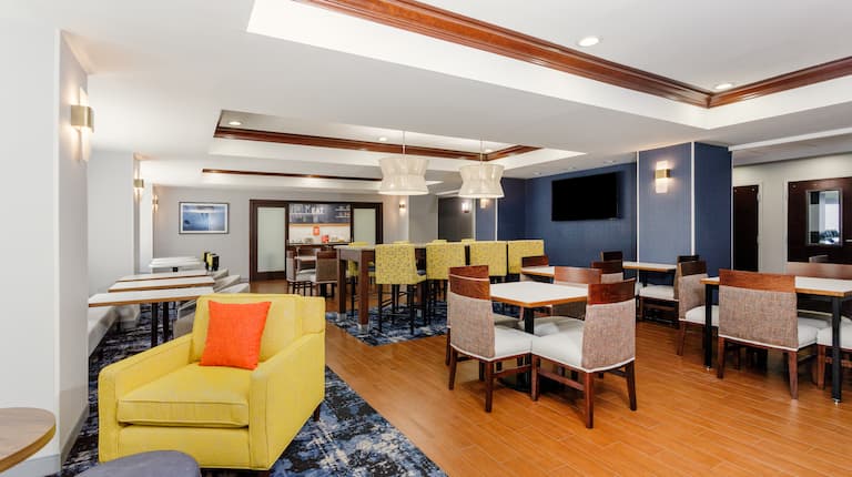 Lobby area with comfortable seating and tables