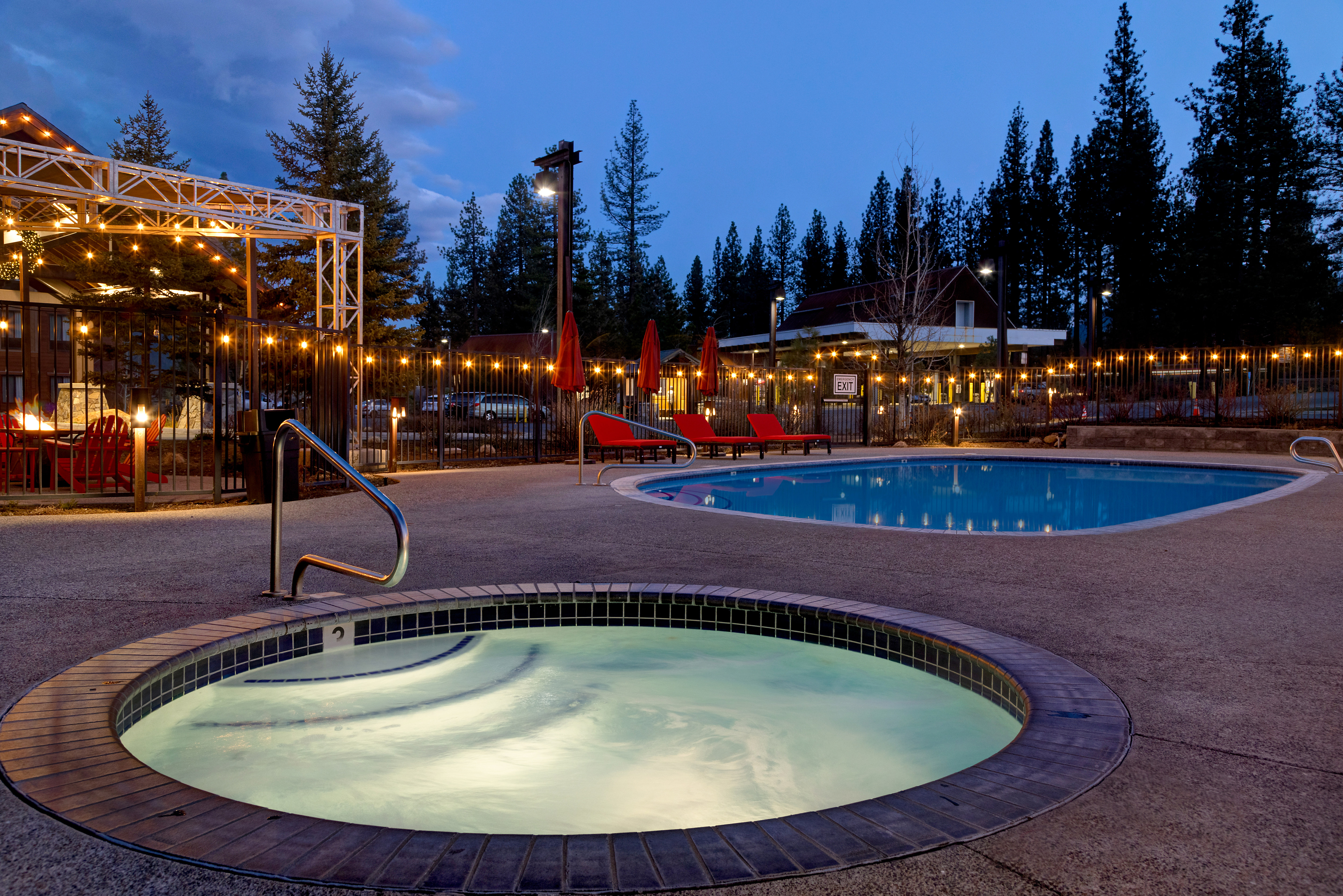 Outdoor Pool and Whirlpool at Night