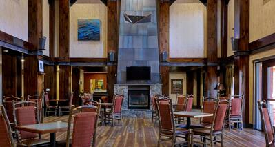 Dining Area in Lobby with Fireplace and HDTV
