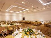 Elegant Banquet and Event Space with Dining Tables and Place Settings 