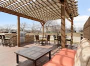 Outdoor Patio with Lounge Seating, Tables, Chairs and Grill