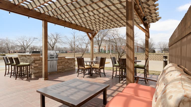 Outdoor Patio with Lounge Seating, Tables, Chairs and Grill