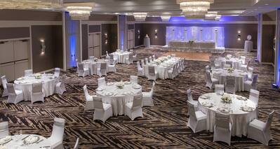Large Space Setup with Round Tables for a Wedding