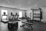 Modern fitness center with cardio and weight equipment 