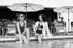 Two women relaxing in pool