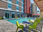 outdoor pool and patio during the day