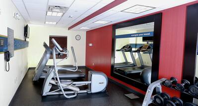 Fitness Center with Recumbent Bike Treadmills and Weights